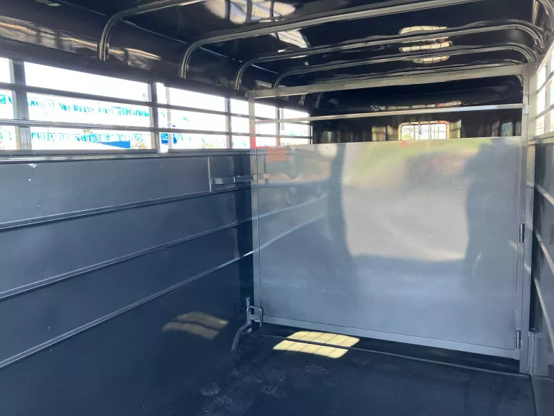 Stock trailer escape door detail on curbside, Delco 16' rental
