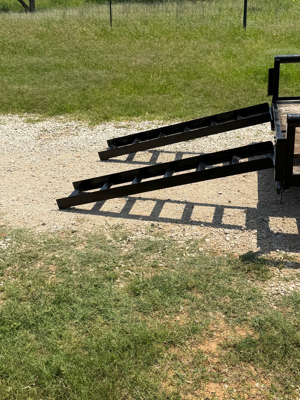 Side view of 6x16 C&M utility trailer rental, tandem axle with drop gate
