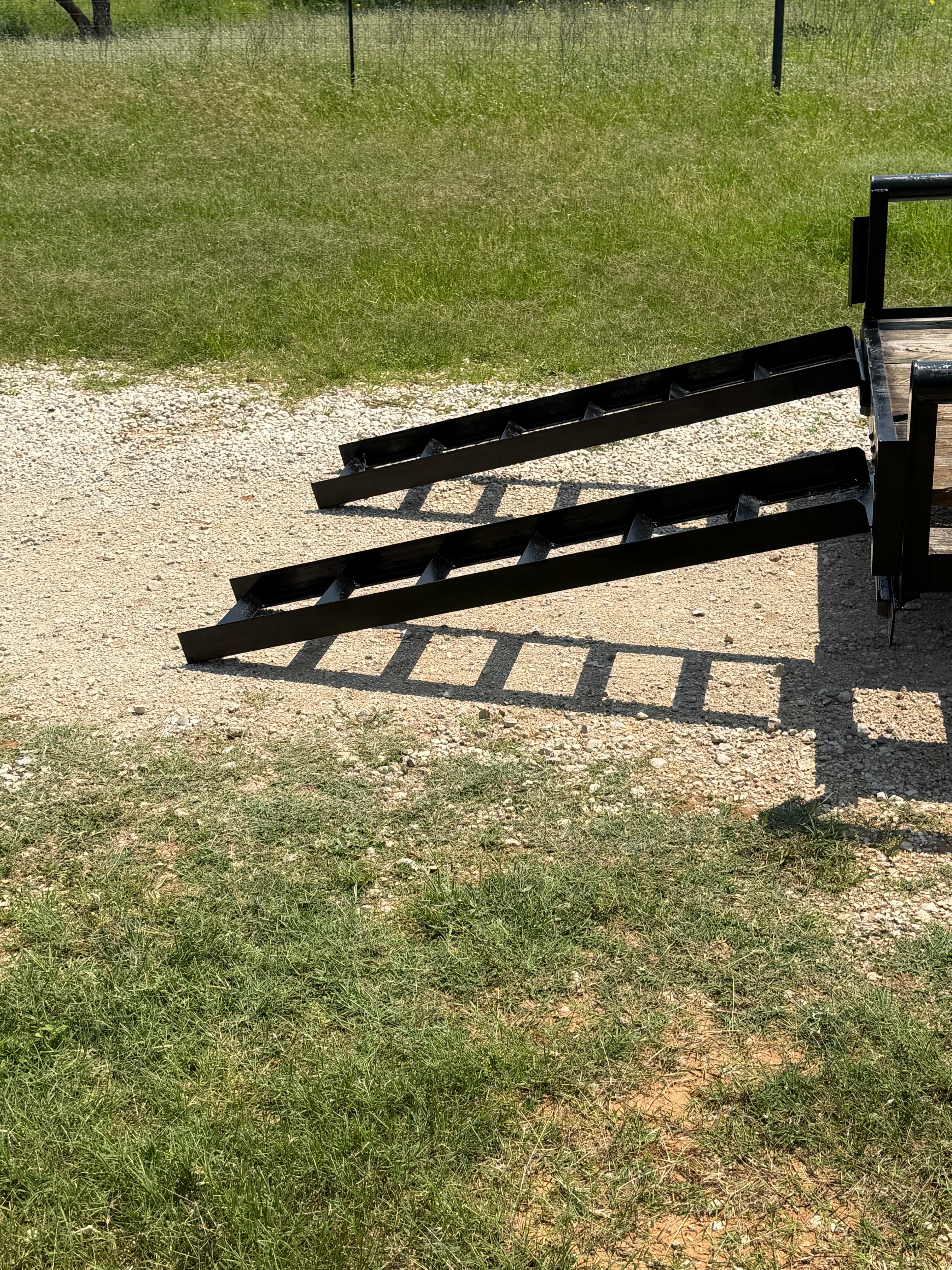 Side view of 6x16 C&M utility trailer rental, tandem axle with drop gate
